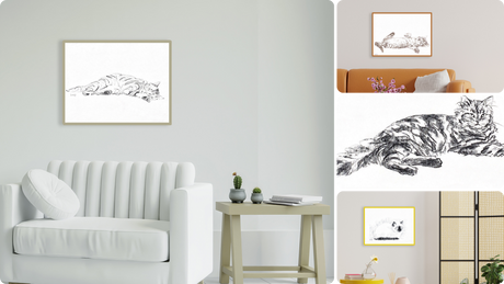 Un sofisticato ambiente interno con tre opere d'arte originali di Amleto in bella vista: due quadri alle pareti rappresentanti gatti in pose rilassate e uno su una mensola, completano armoniosamente l'arredo moderno della stanza.