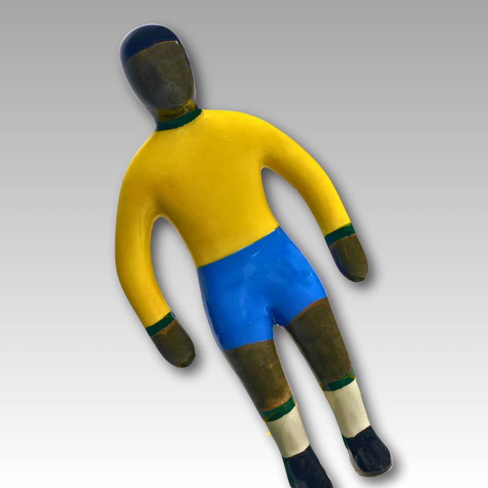 Statuina ceramica Subbuteo gialla e blu inclinata