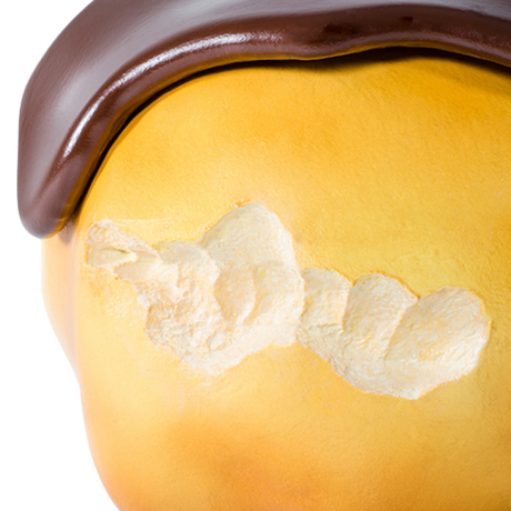 Dettaglio del pouf Big Eat Bignè con glassa al cioccolato