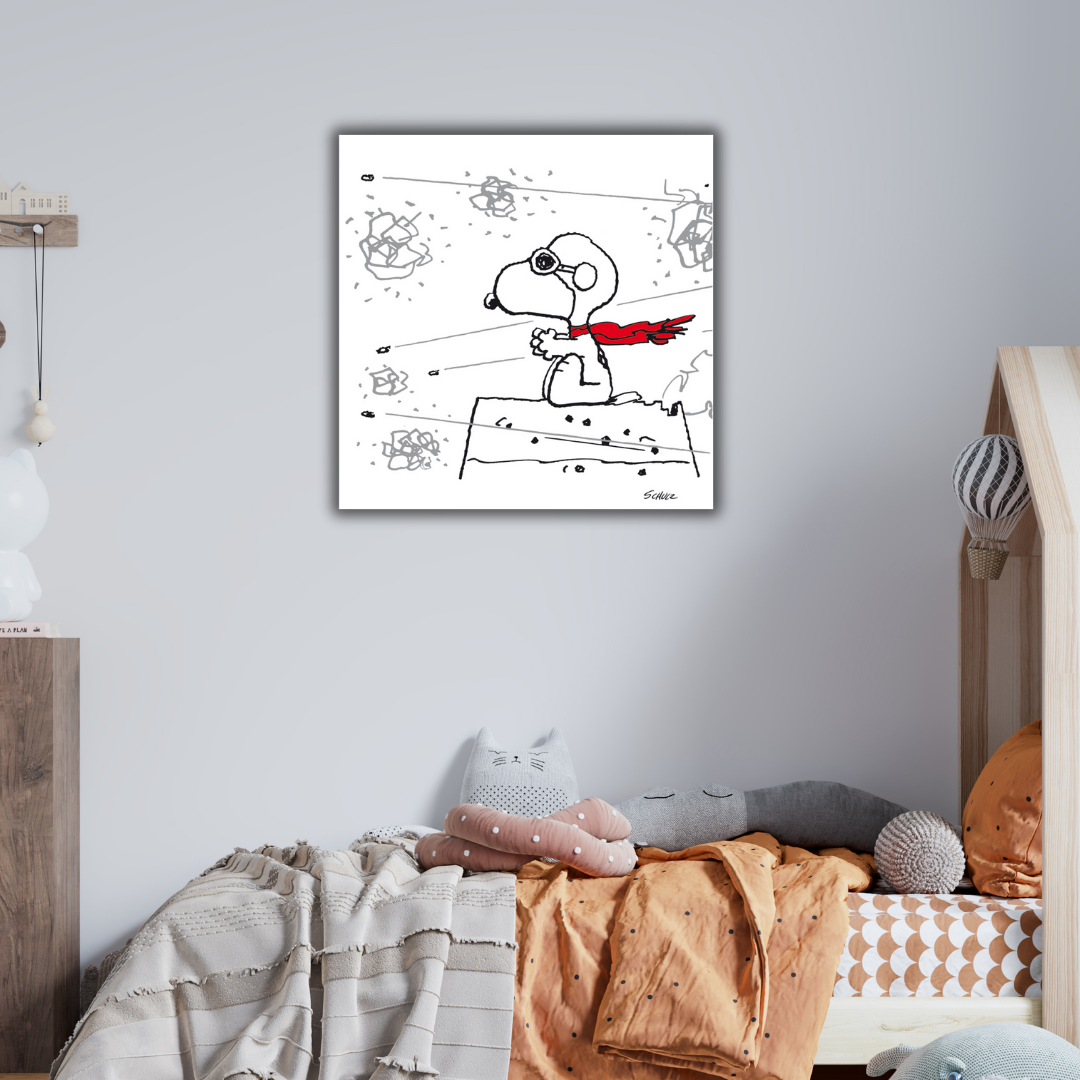 Snoopy, the Red Baron ritrae Snoopy con una sciarpa rossa, in posa eroica sopra la sua cuccia, immaginandosi come un aviatore.