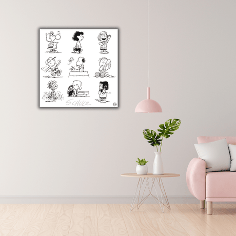Ambientazione della Serigrafia 'Peanuts e gli Amici di Schulz' in elegante cornice, perfetta per aggiungere un tocco artistico alla tua casa. Stampa in B/N su parete.